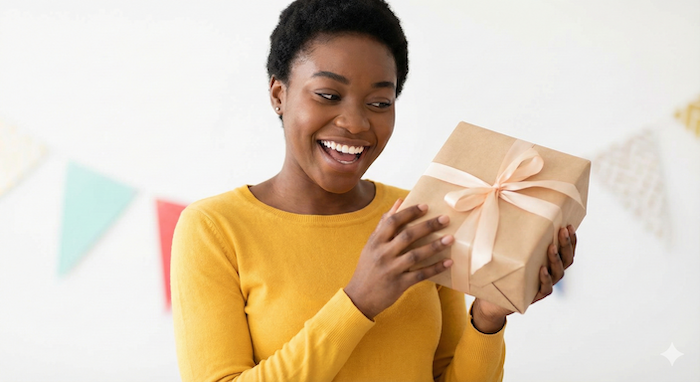 Happy person holding a gift. / プレゼントを持って喜ぶ人。